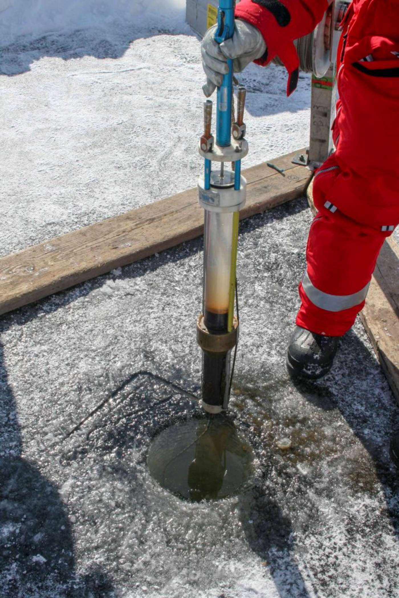Researchers on a frozen lake