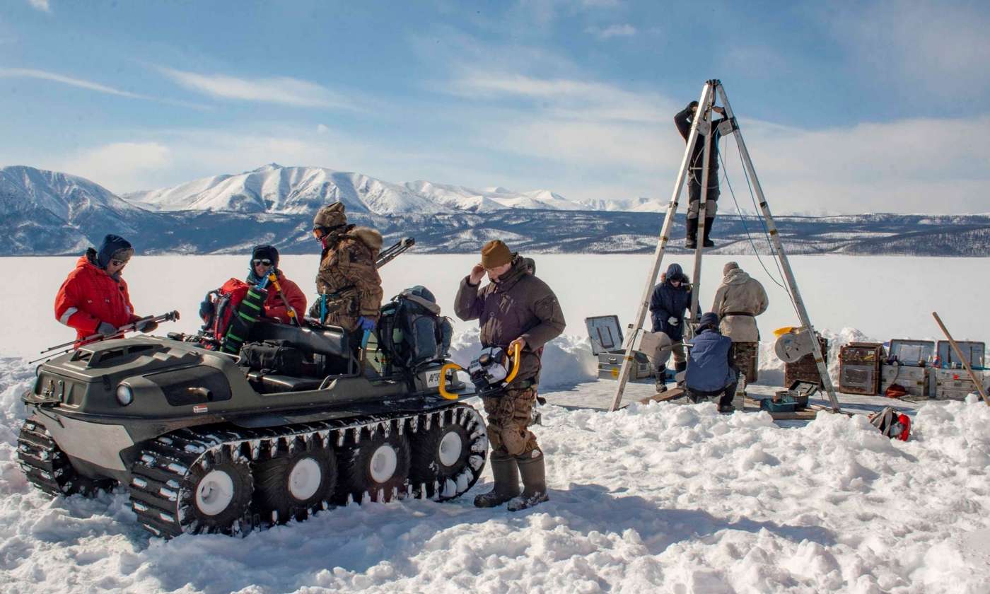 Researchers on a frozen lake